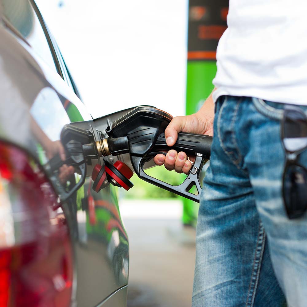 Man pumping fuel into car